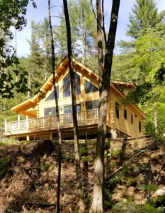 Log off in this Katahdin Cedar Log Home