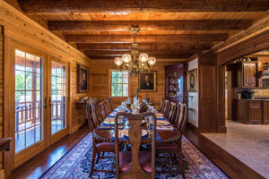 Formal dining in Victorian log home by Katahdin Cedar Log Homes