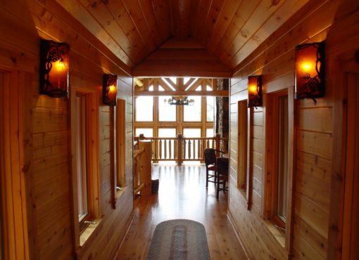 custom lighting in custom log home hallway
