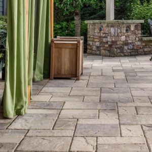 Rustic slab pavers complement traditional Katahdin Cedar Log Homes