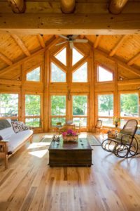 Custom Log Home interior with floor to ceiling windows