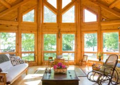 Custom Log Home interior with floor to ceiling windows