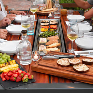 Social grilling tables by iBBQ can enliven your Katahdin Cedar Log Home entertaining.