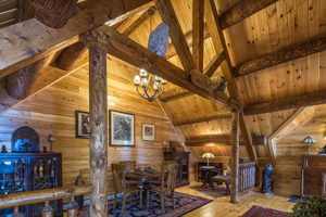 Owls Nest nook has wooden carvings to complement Katahdin Cedar Log Home & Victorian Log HomeDecor