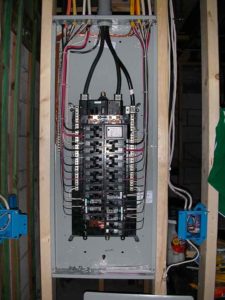 Installing an electrical panel in a Katahdin Cedar Log Home 