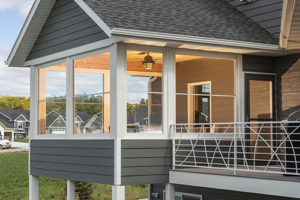 Scenix white retractable screen windows expand the outdoors in Katahdin Cedar Log Homes