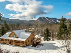 Log off in this Katahdin Cedar Log HOme with all the amenities